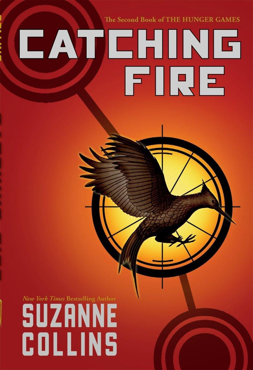 Catching Fire  book 1 by Suzanne Collins (Author)