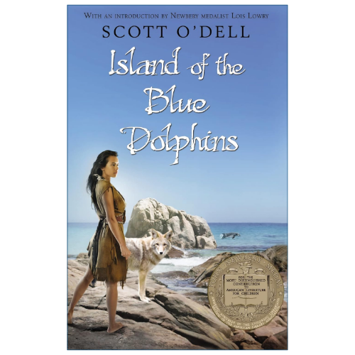 Book cover for 'Island of the Blue Dolphins' by Scott O'Dell, featuring a woman standing on a rocky beach with a wolf and ocean in the background under a blue sky.