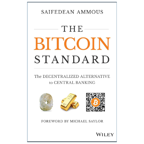 Book cover of 'The Bitcoin Standard' by Saife Dean Ammous, published by Wiley. The cover is white with a thin dark border, featuring the title in dark gray and orange text, and small illustrations of a gold ingot, a coin, and a Bitcoin QR code.